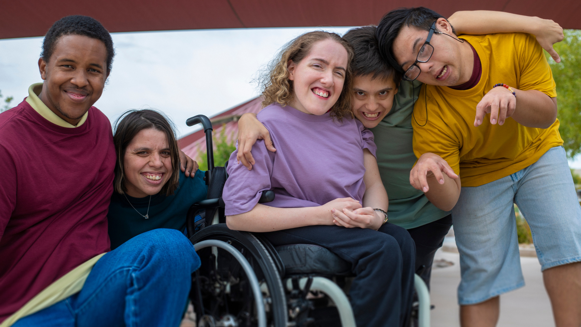 person with spina bifida having fun with friends