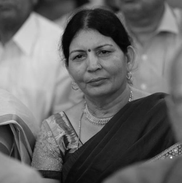 usha sharma smiling in a black and white picture