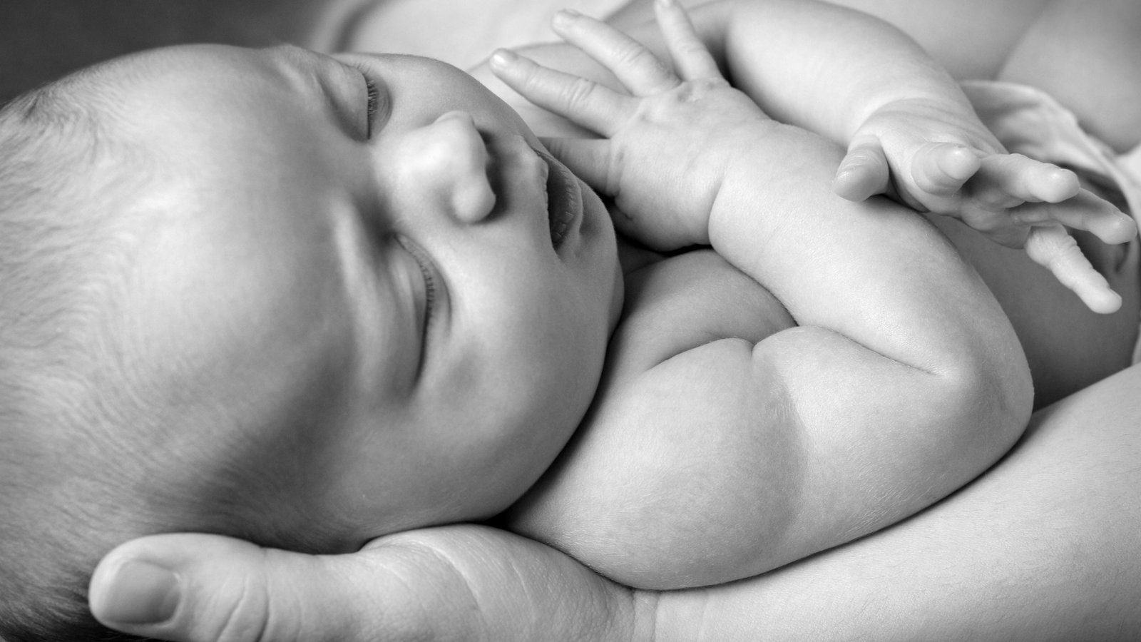 mother holing a baby representing spina bifida