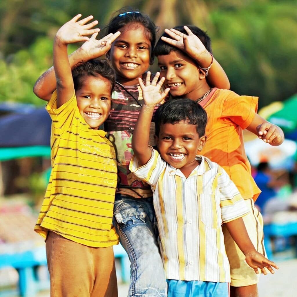 four happy kids saying hi to lovely people who donated for them