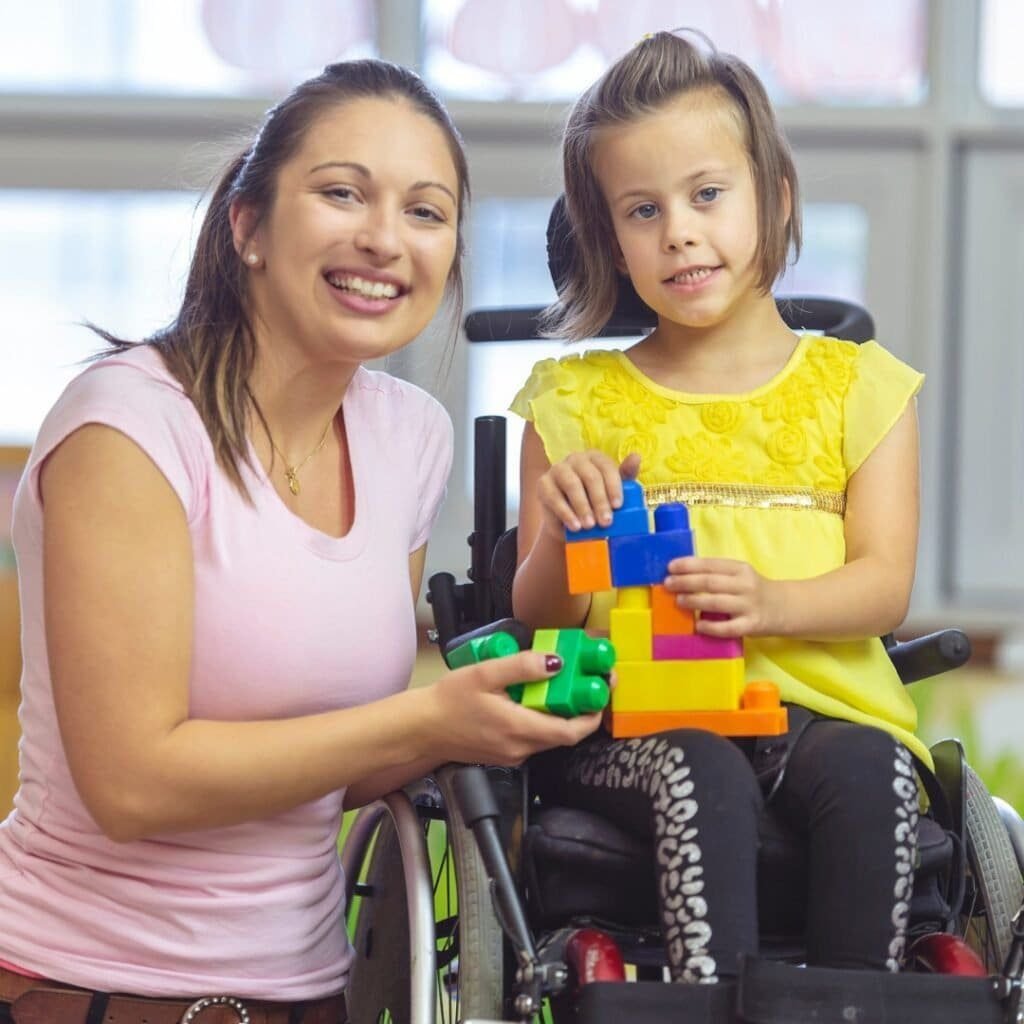 a lovely mother with her specially abled daugther hoping that you would donate